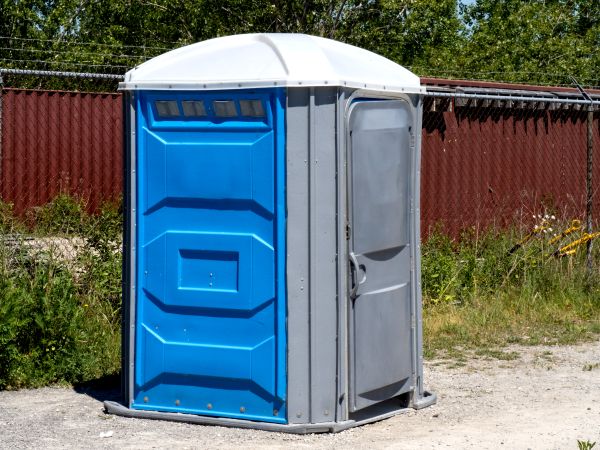 Construction porta potty on a jobsite in Central Texas